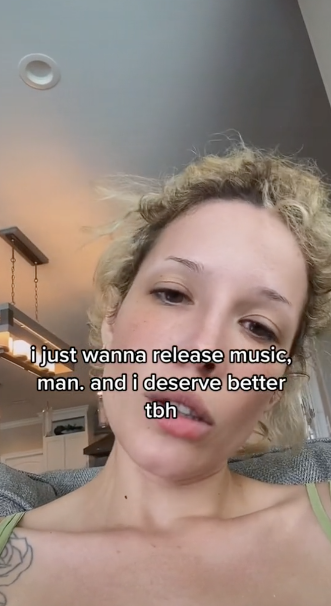 Closeup of Halsey on TikTok with text that reads, &quot;i just wanna release music, man. and i deserve better tbh&quot;