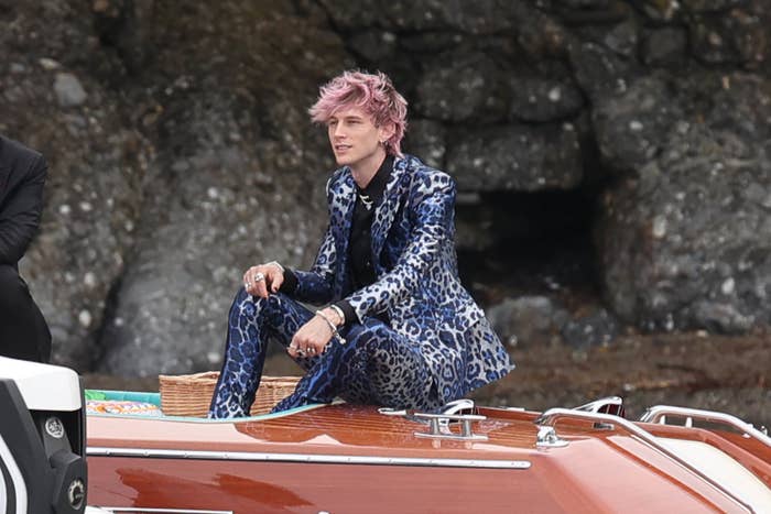 Machine Gun Kelly sitting on a boat