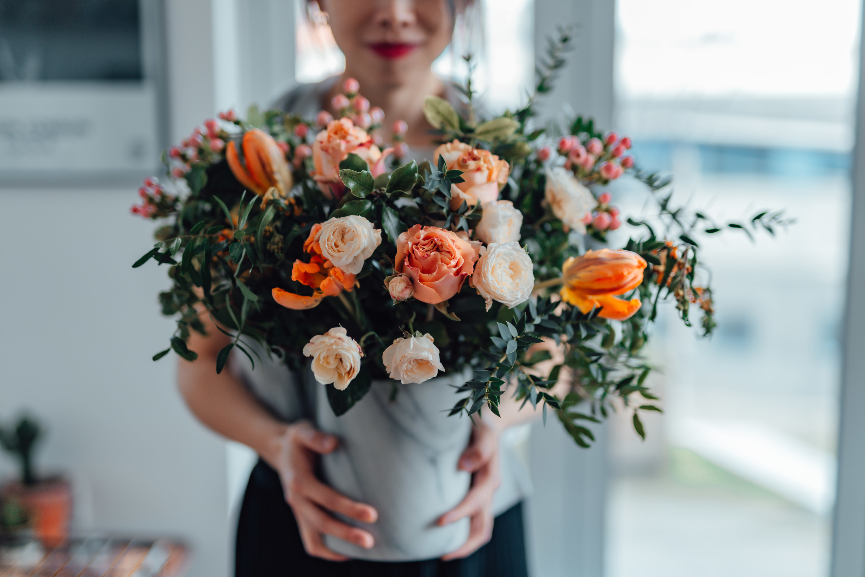 A woman holding fresh flowers
