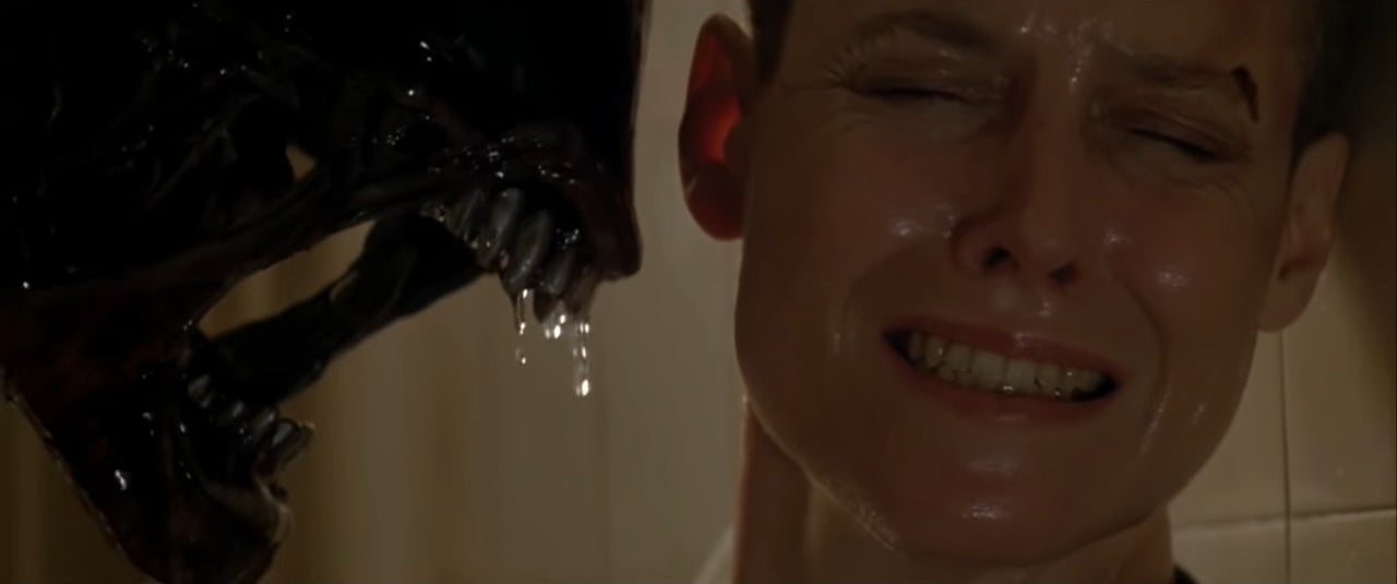 Ripley with a Xenomorph hissing next to her in &quot;Alien 3&quot;