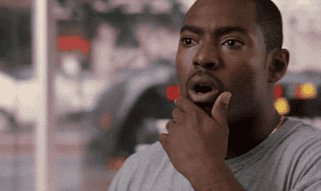 A GIF from TV series The Wire of a man looking shocked
