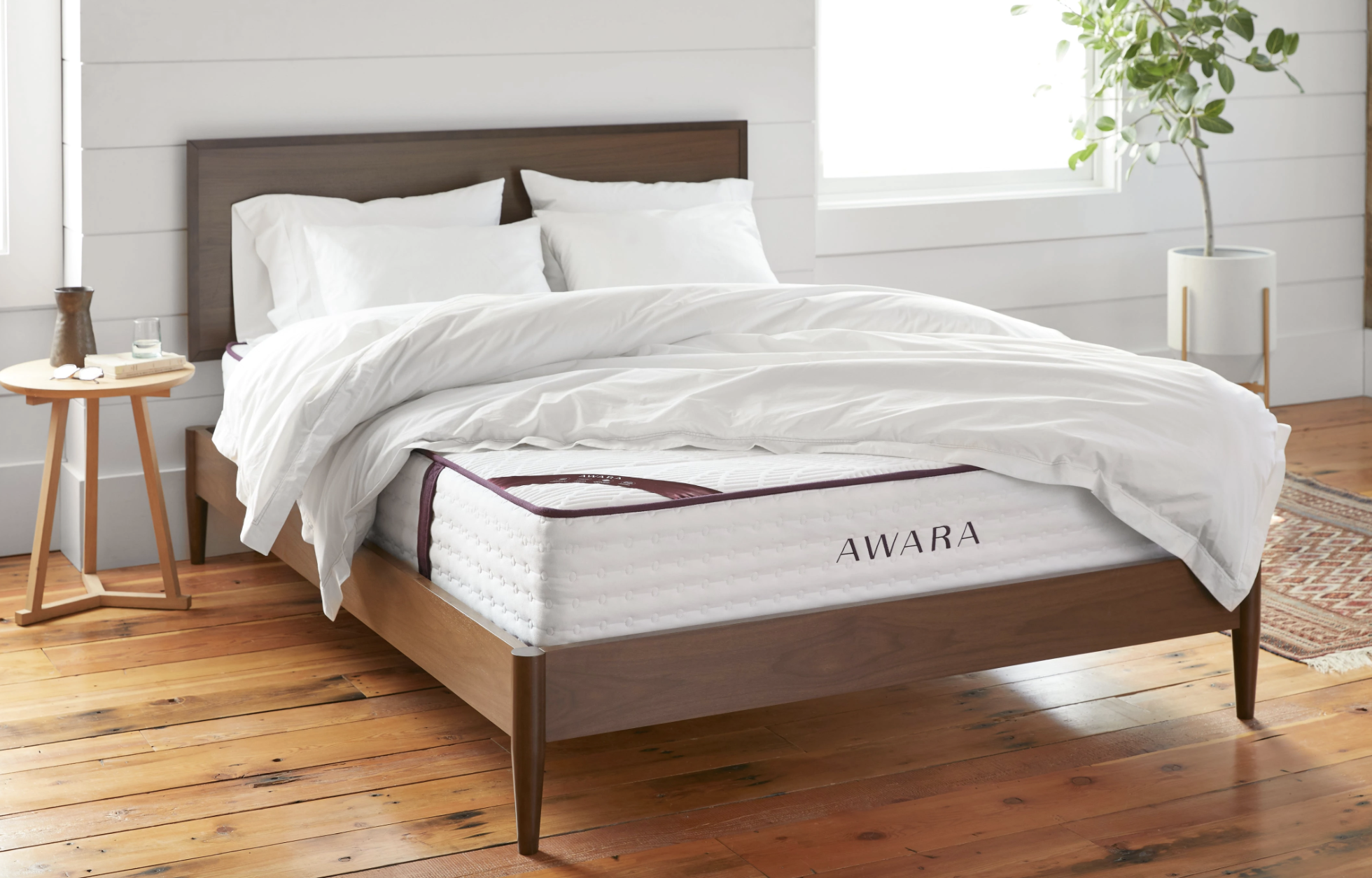 awara mattress on a bed frame with accessories on top