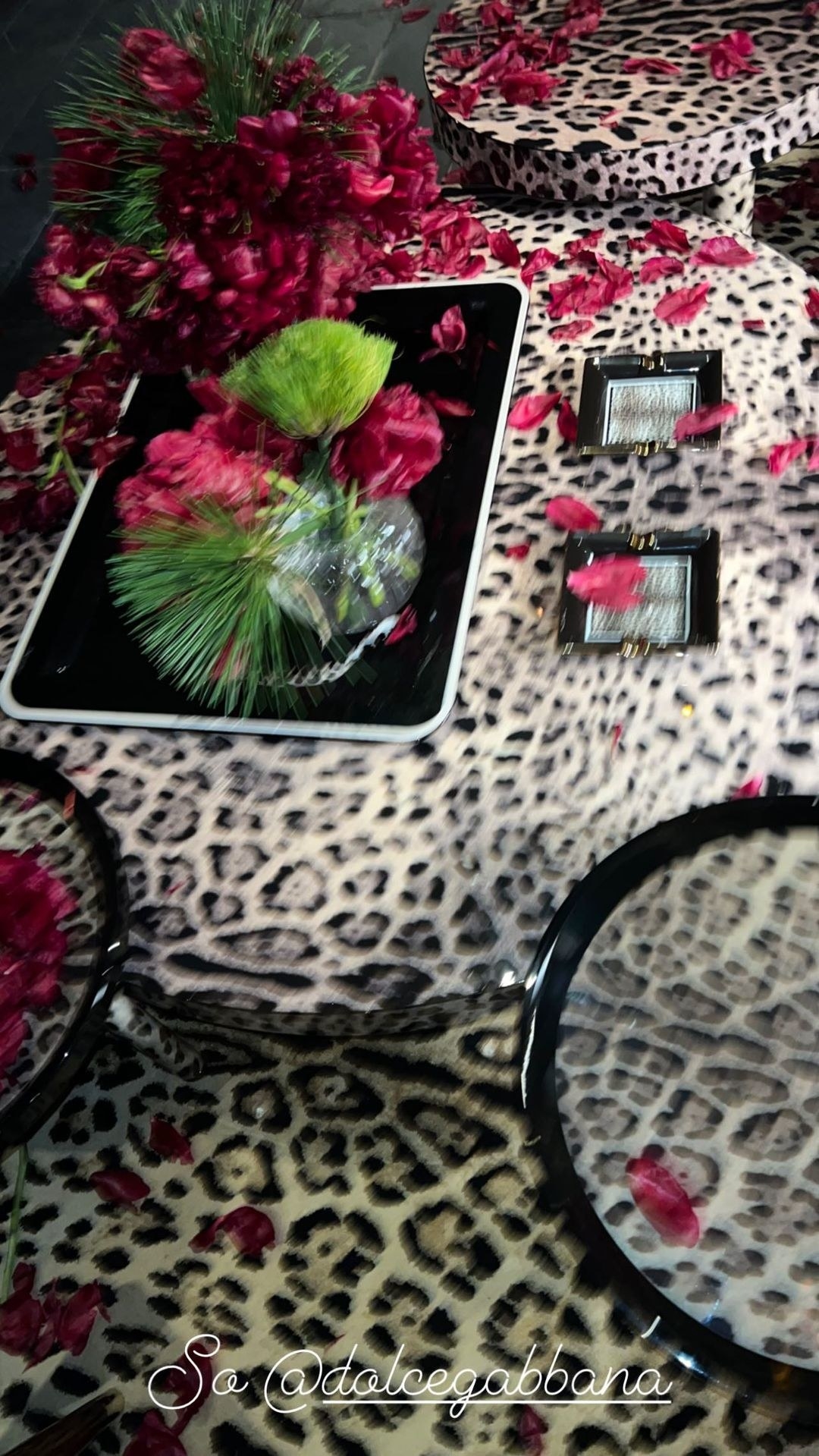 The tables are covered with leopard print designs and hold flowers