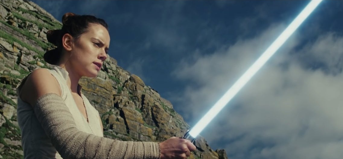 Rey wielding her lightsaber on Ahch-To in &quot;Star Wars: Episode VIII - The Last Jedi&quot;