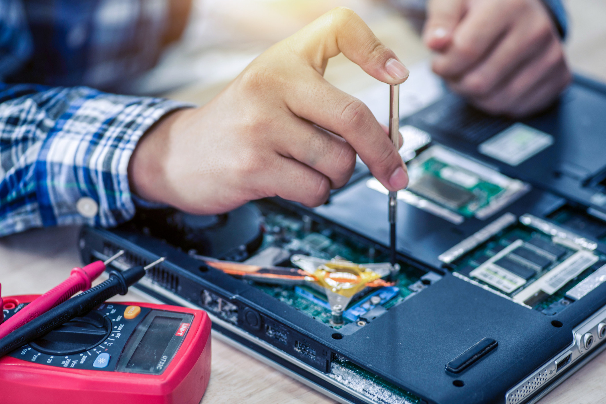A person repairing a computer