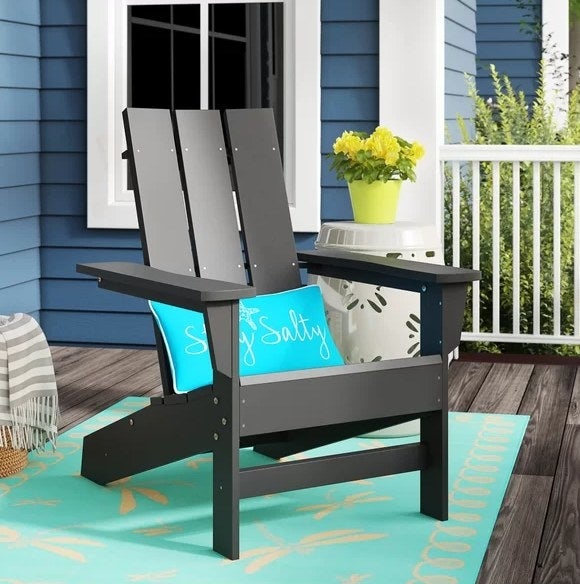 An image of a plastic Adirondack chair that is weather-resistant can has a 300-pound seating capacity.