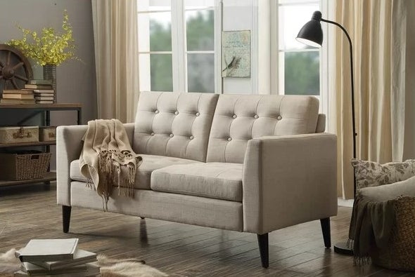 An image of a beige square arm loveseat with removable back and front seat cushions
