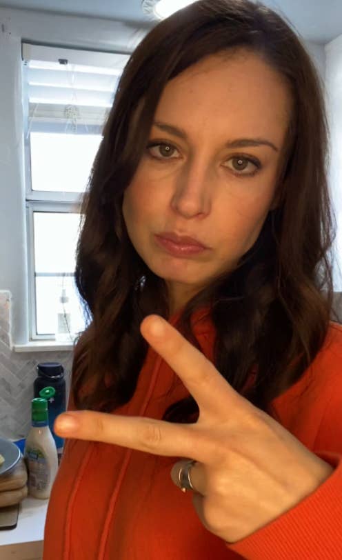 Krista Torres throwing the peace sign