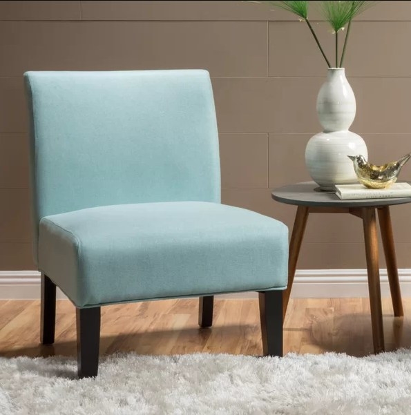 An image of a light blue slipper chair with a weight capacity of 230 pounds
