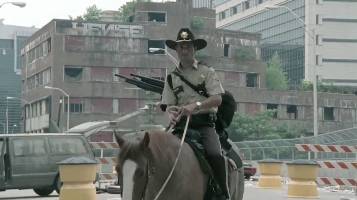 Grimes on horseback in post-zombie apocalypse Atlanta