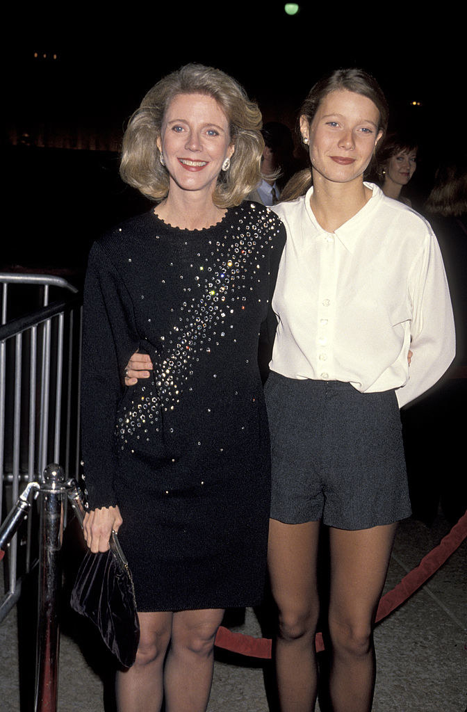 Blythe Danner wears a long sleeve bejeweled mini dress and Gwyneth Paltrow wears shorts and a button up blouse