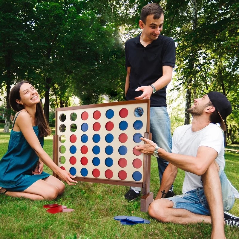 Three people playing the 4-in-a-row game