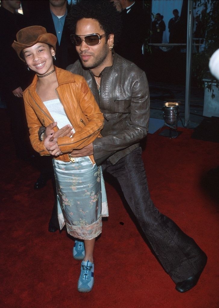 Zoë Kravtiz wears a leather jacket with a knee length skirt and Lenny Kravitz wears an all leather outfit