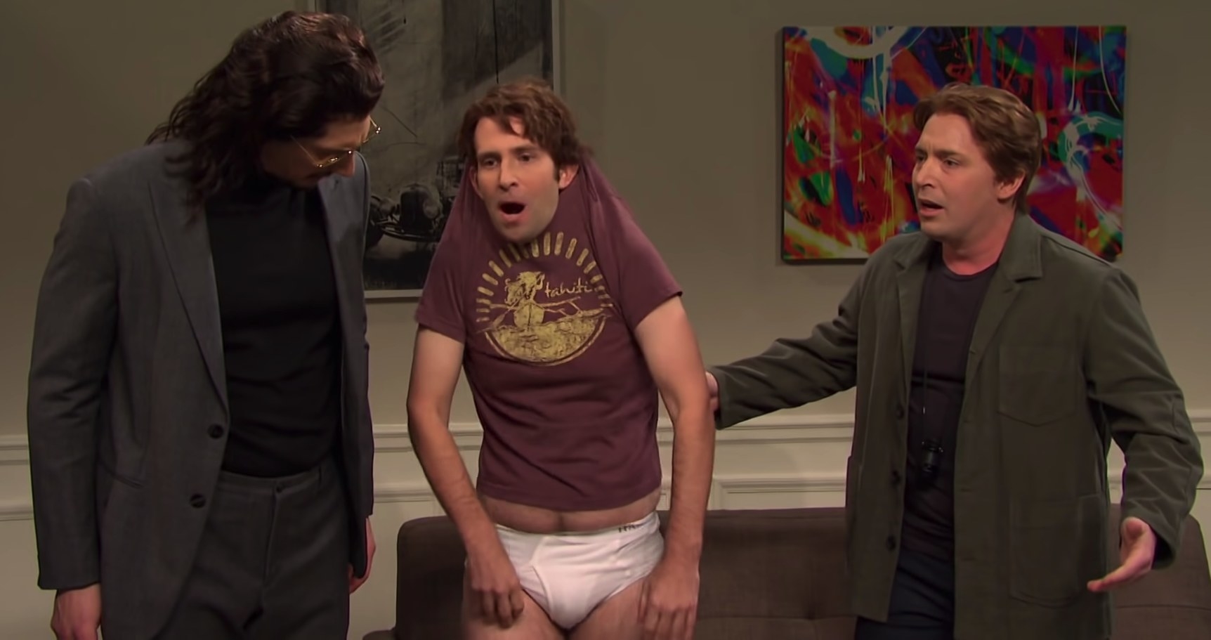 Kyle Mooney in his underwear, shit pulled over his head, singing