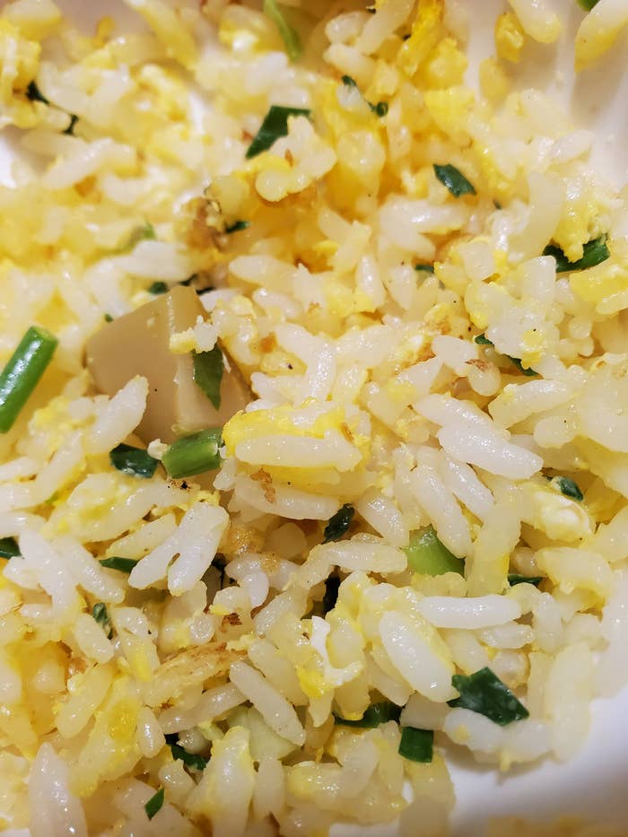A close-up of fried rice with eggs.
