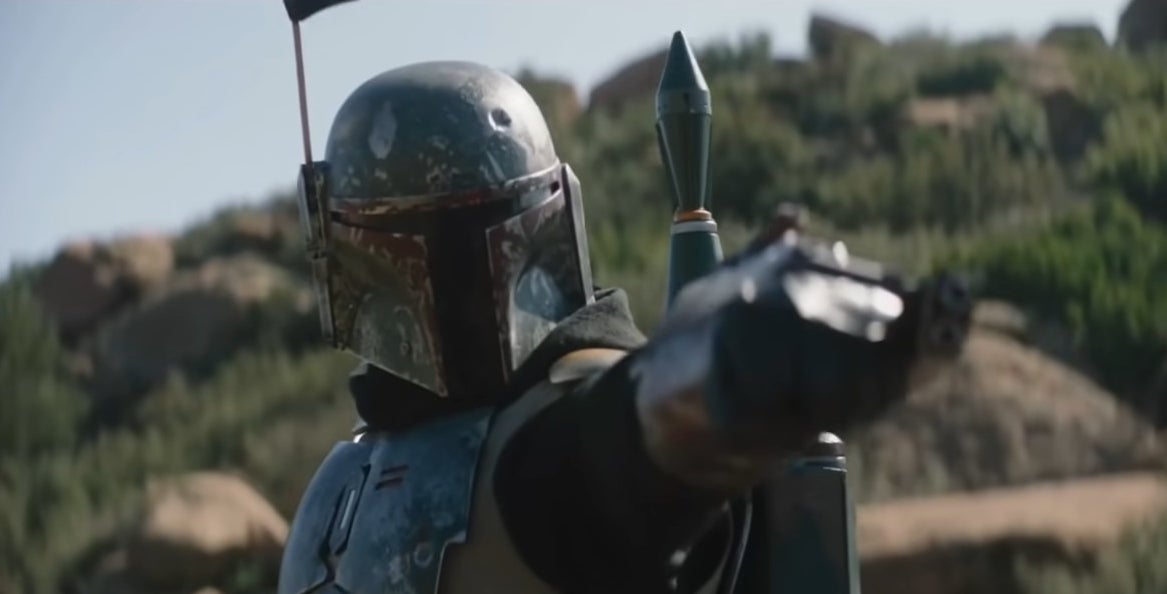 Boba Fett pointing his arm cannon at someone in &quot;The Mandalorian&quot;