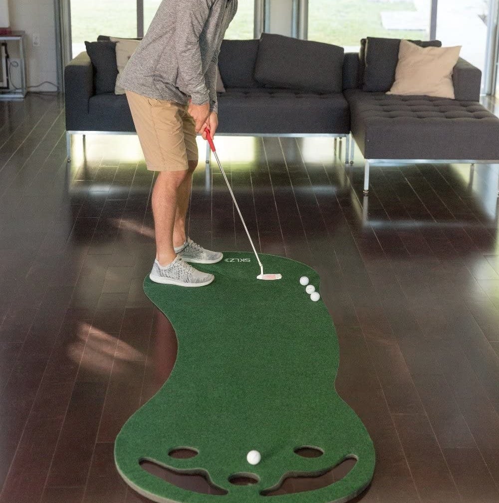 A person using the indoor green in a living room