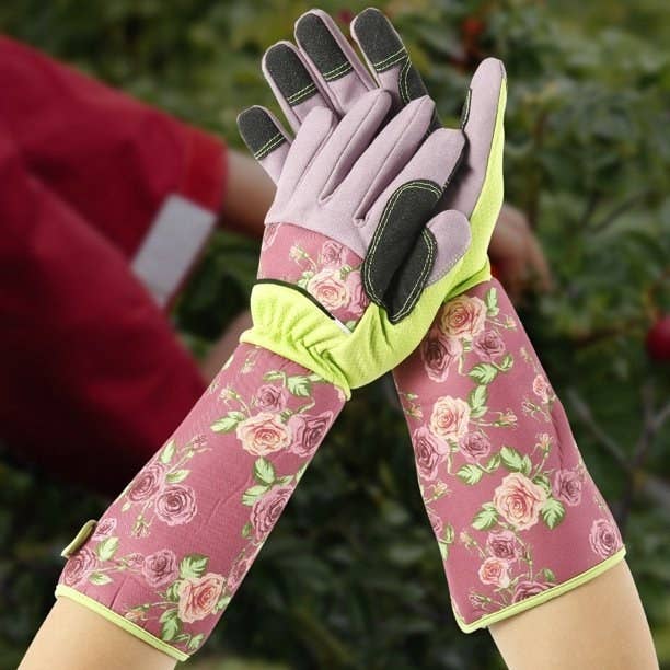 Model wearing rose printed gloves