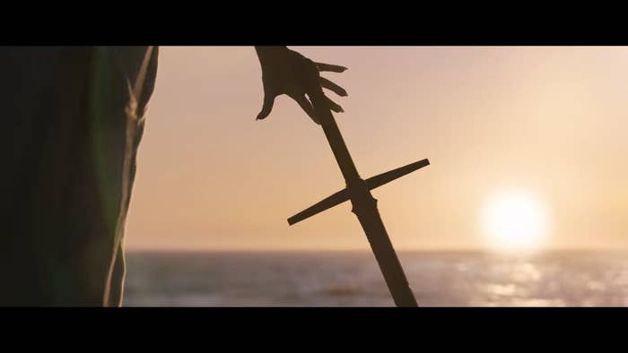 Gorr reaching for a sword in front of the sun in &quot;Thor: Love and Thunder&quot;