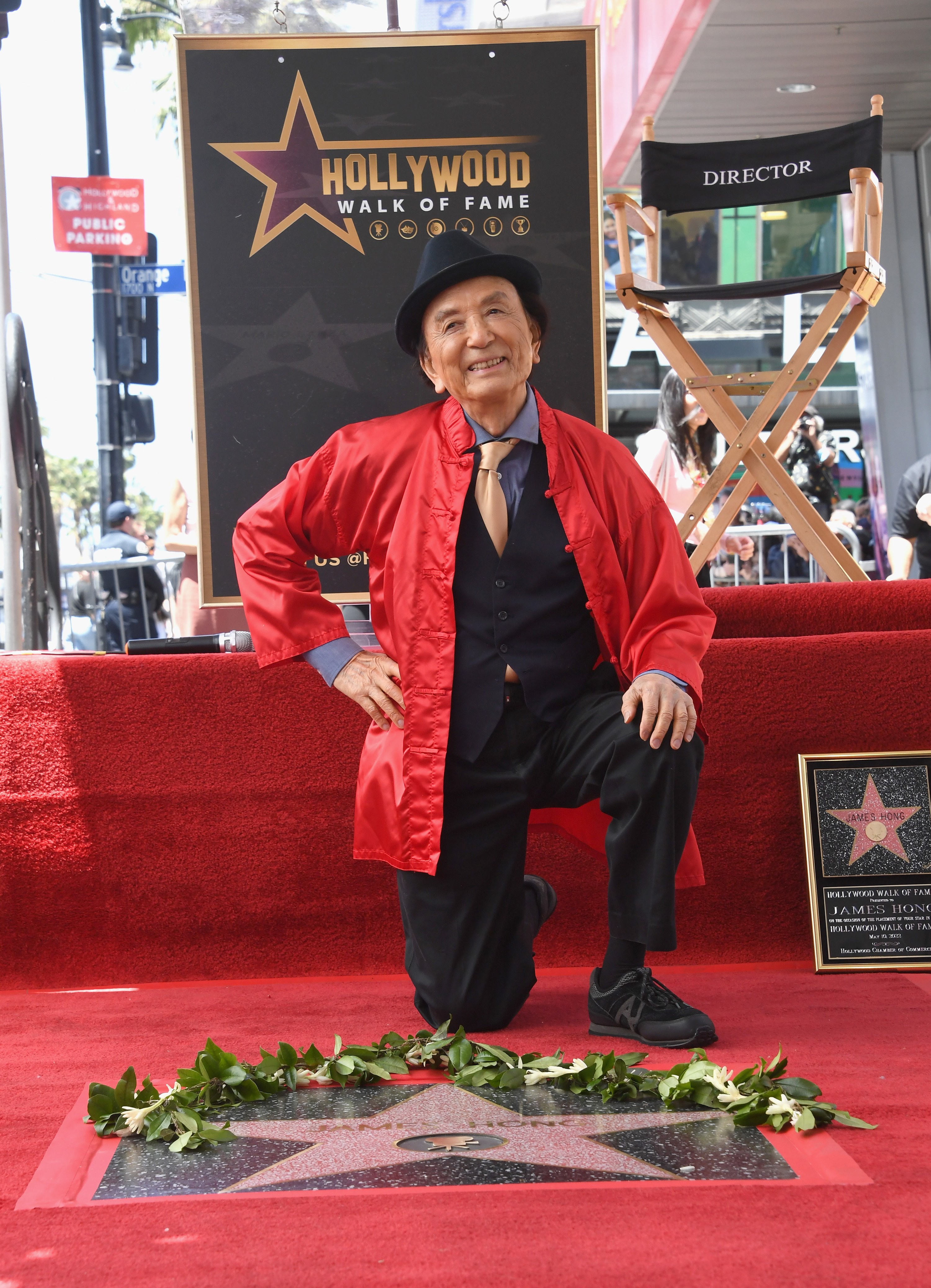 James kneeling down next to his Hollywood star