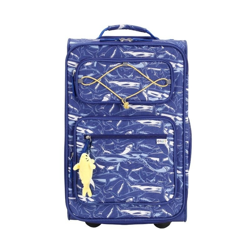 An image of a kid&#x27;s soft carryon suitcase with exterior pockets, a fully lined interior,  and a removable hanging plush dangle