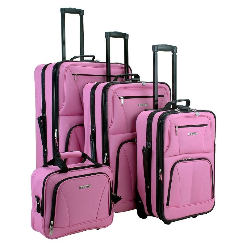 An image of a four-piece pink luggage set