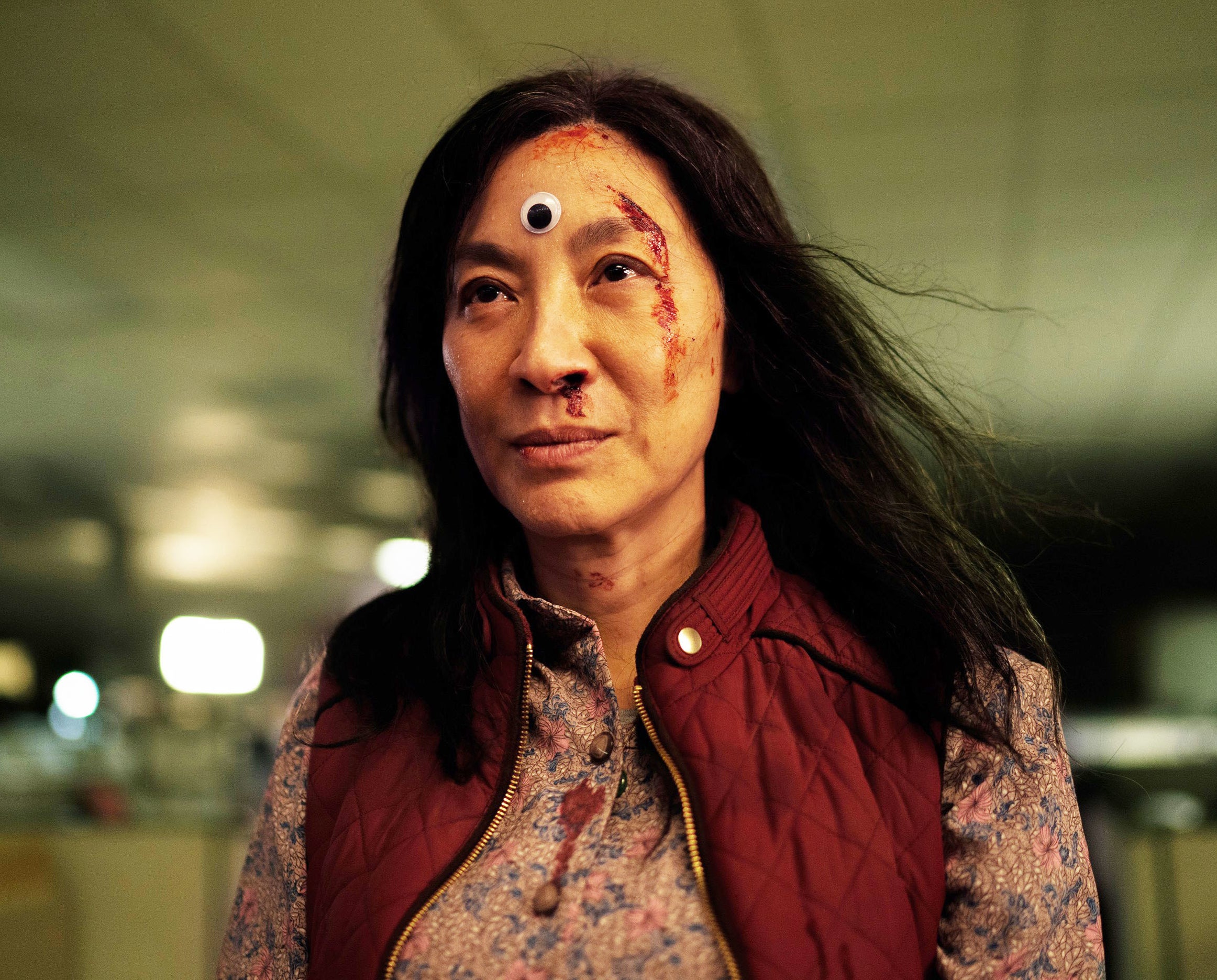 Michelle with blood on her face and a large glue-on eye on her forehead