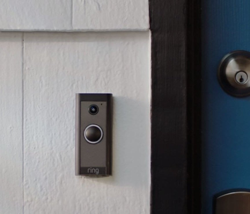 the video doorbell on the outside of a front door