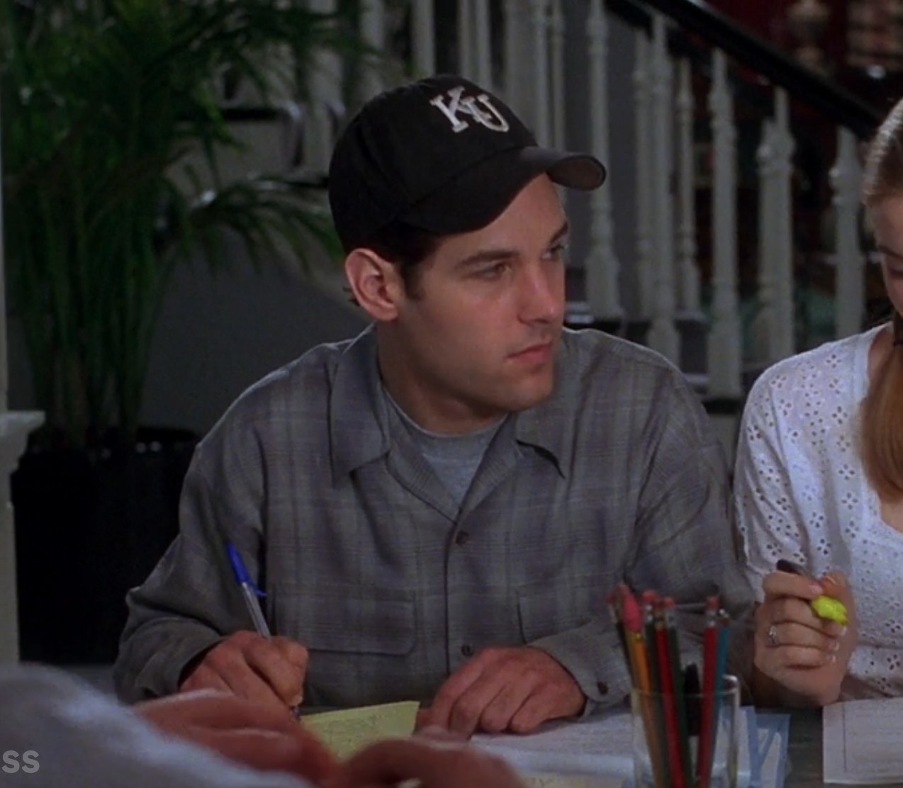 Paul Rudd as Josh does some paperwork alongside Cher in &quot;Clueless&quot;