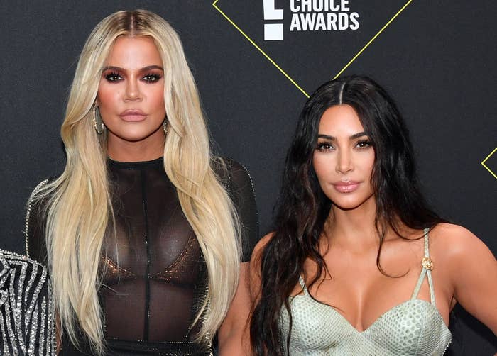 Kim and Khloe pose together at an event