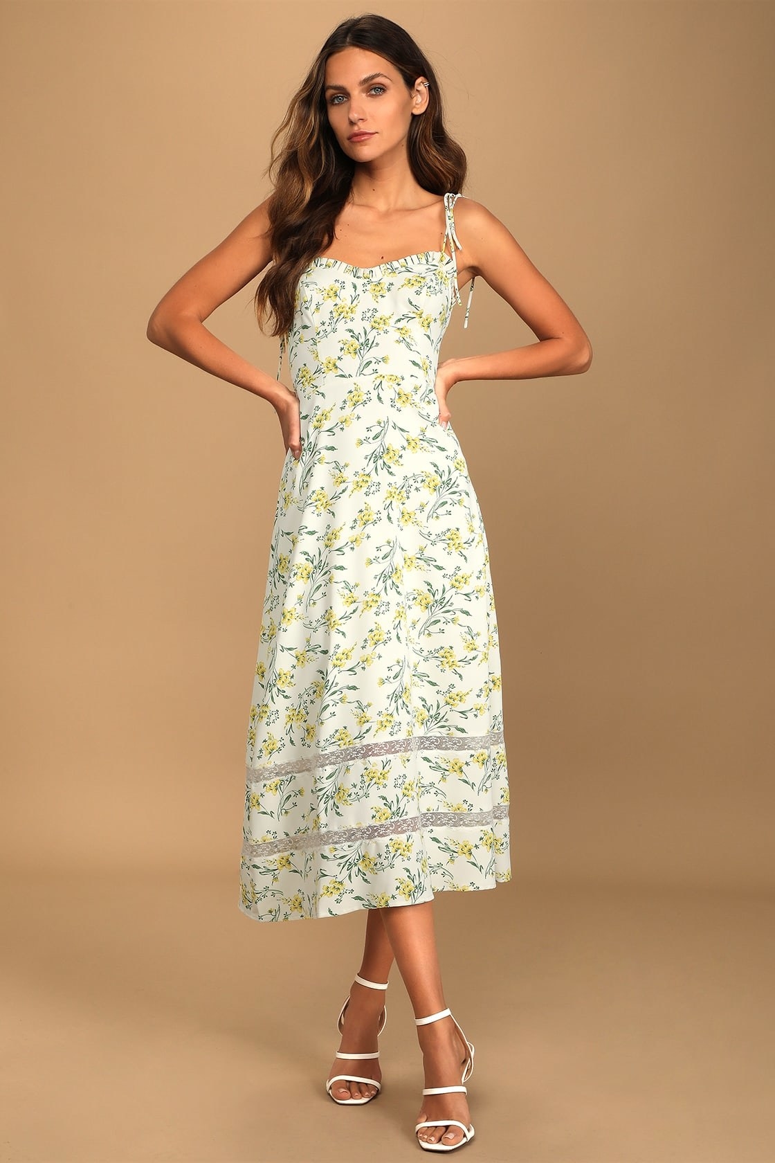 model in a floral tie-strap midi dress with a ruffled sweetheart neckline