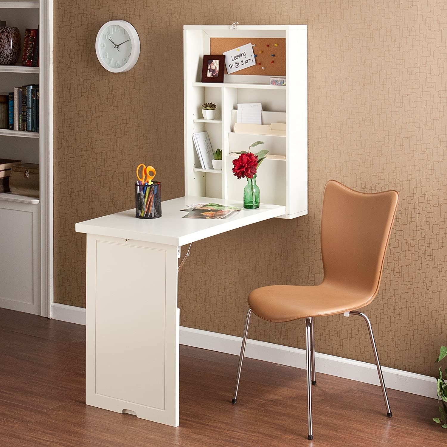 the white fold down table with a chair in front of it