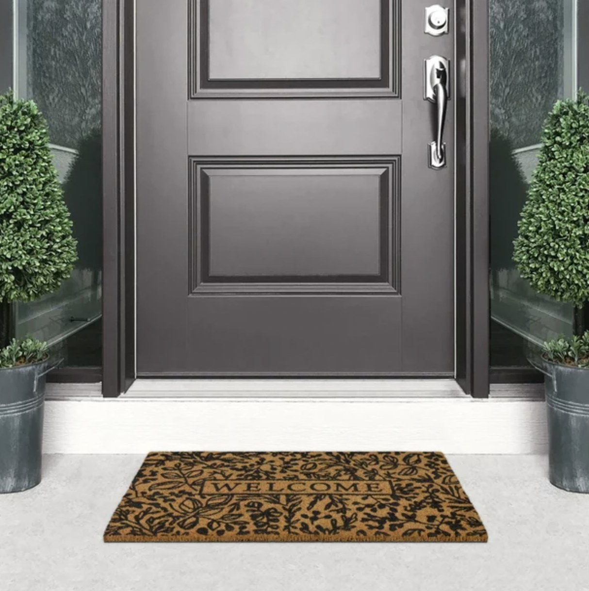 The doormat in front of a black front door