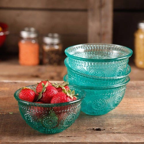 the four bowls, three stacked together and one filled with ripe strawberries