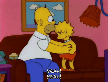 A gif of Homer and Lisa Simpson on the couch shouting &quot;yeah&quot;