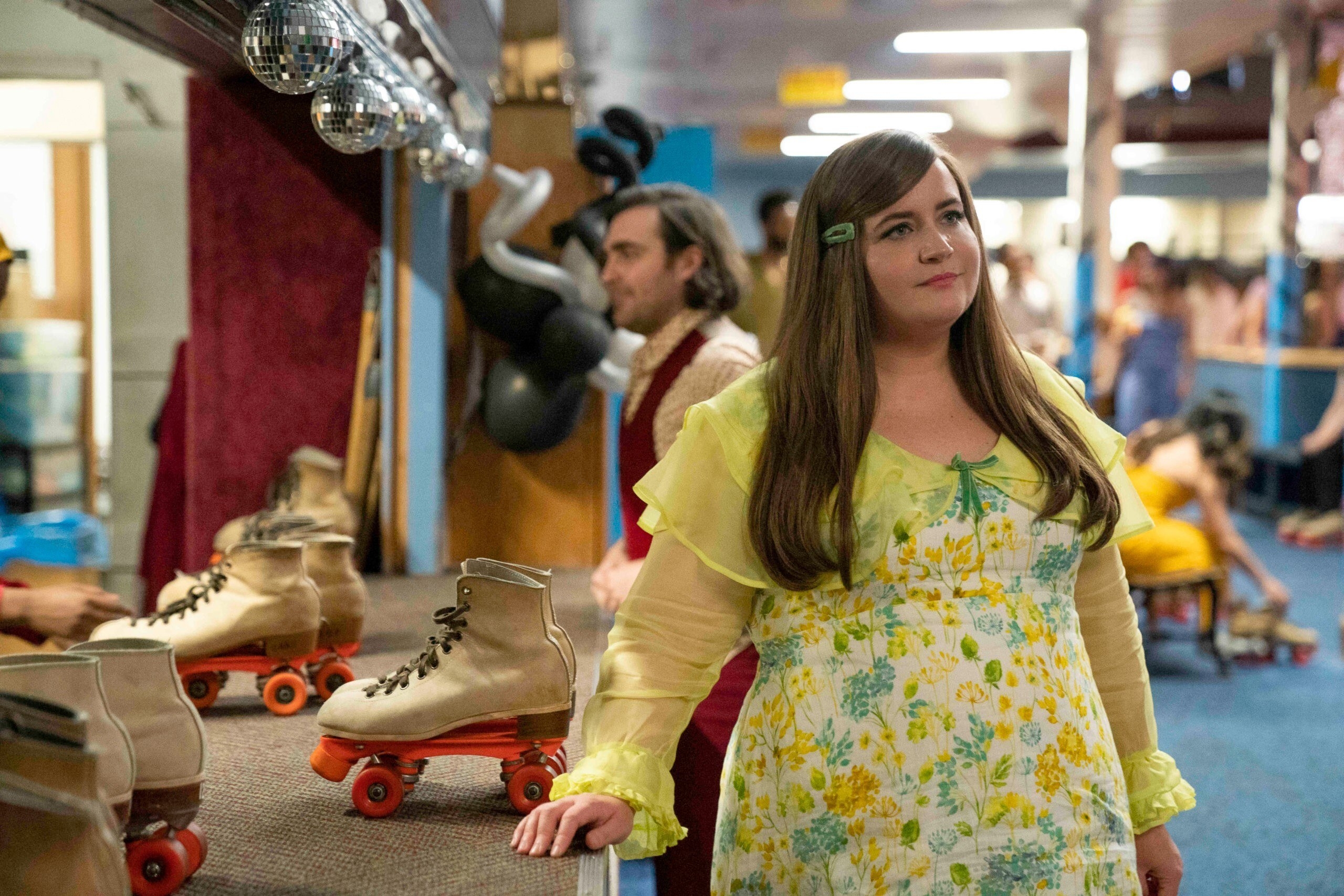 Aidy Bryant poses at a roller rink counter in &quot;Shrill&quot;