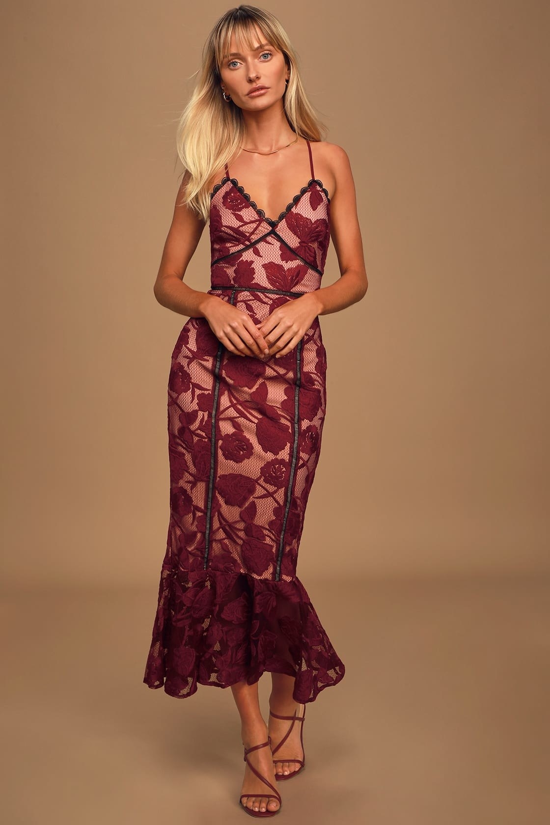 model in maroon trumpet midi dress with spaghetti straps