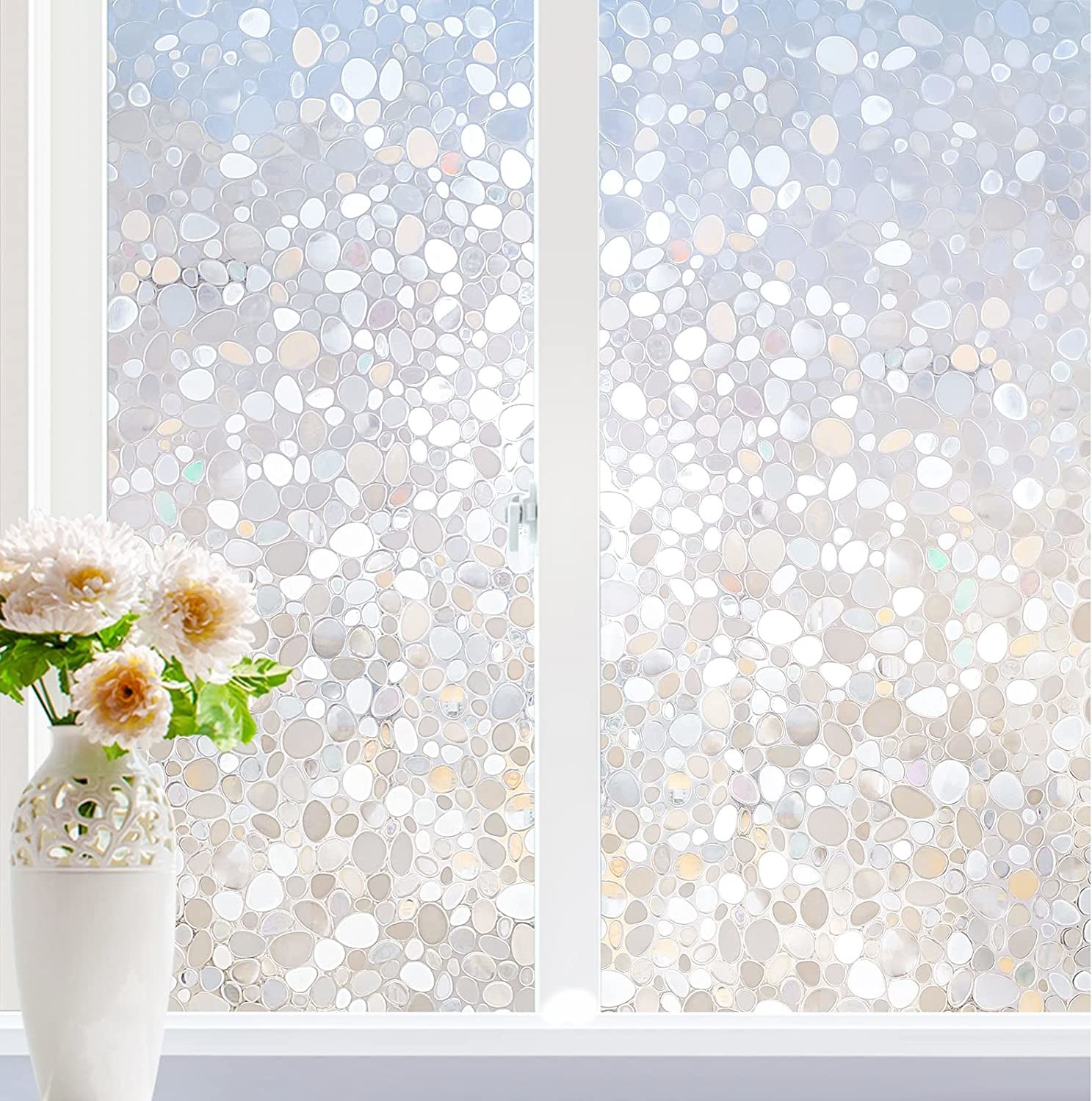 windows covered in the sparkly window film beside a vase of flowers
