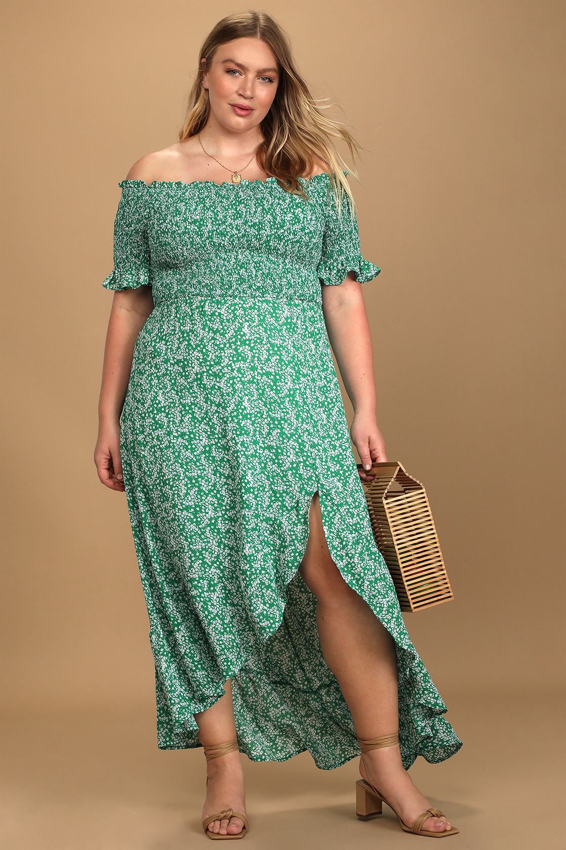 model in green and white floral slightly high low slitted maxi dress with shirred top and shirred off the shoulder sleeves