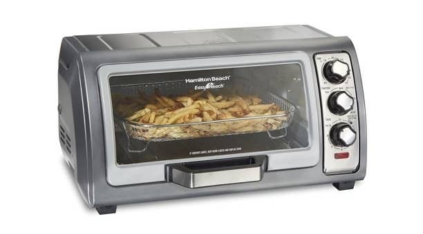 the grey toaster oven with a basket of fries