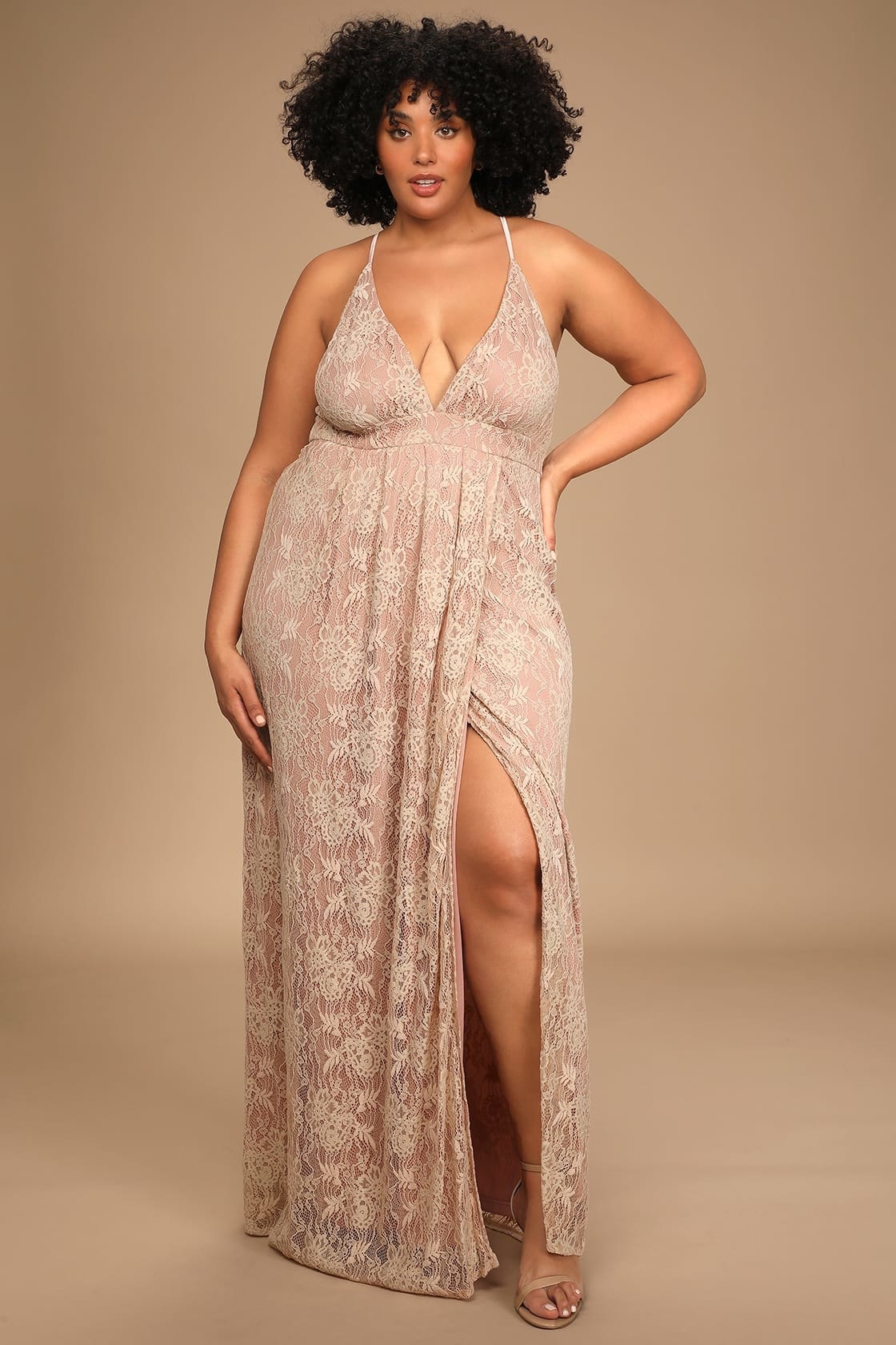 model in dusty rose lace maxi dress with v-neck, spaghetti straps, and a high slit