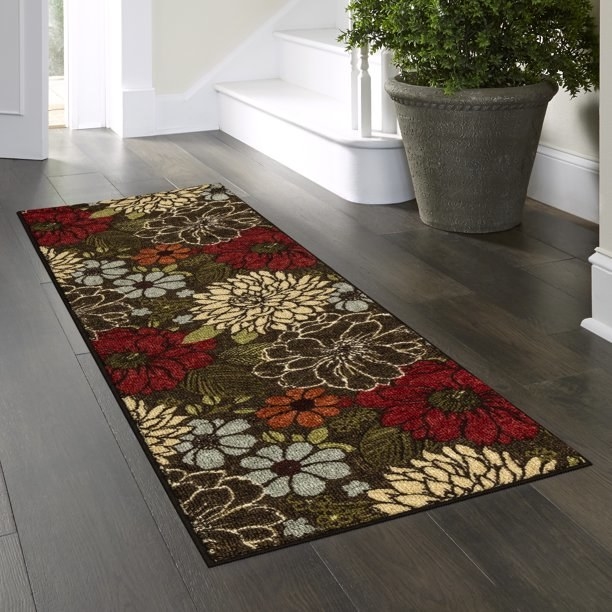the floral rug runner in an entryway