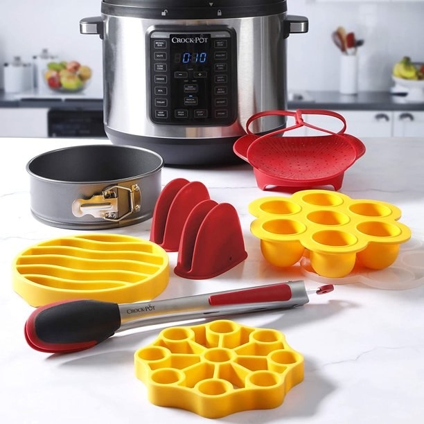 the red and yellow silicone accessories in front of a pressure cooker