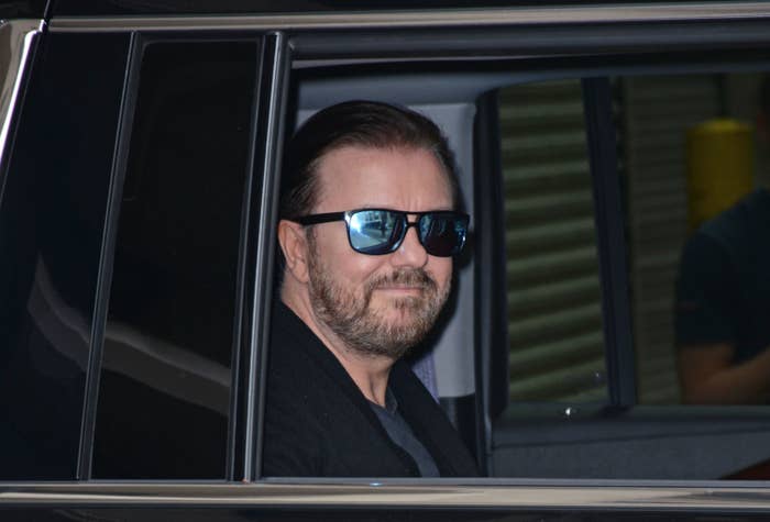 Ricky sitting in a car while wearing sunglasses