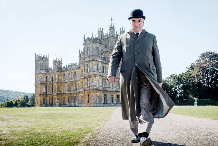 John Bates walking away from the country house.