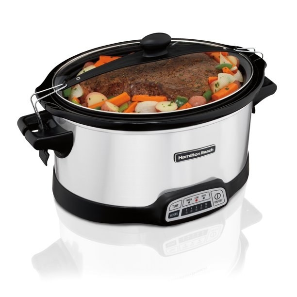the silver slow cooker with lid clips, full of meat and vegetables