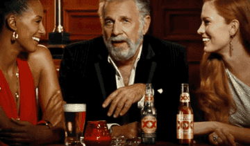 The Dos Equis guy with two women at a bar