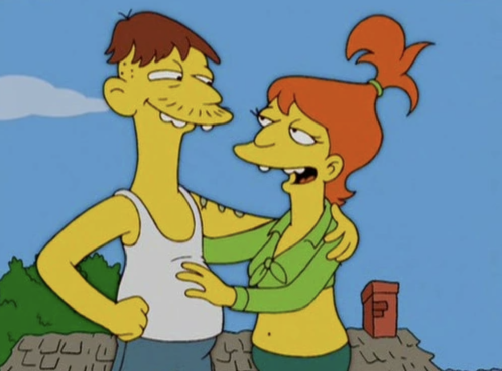 Cletus, wearing a white singlet, stands outside arm in arm with his redhead wife Darlene