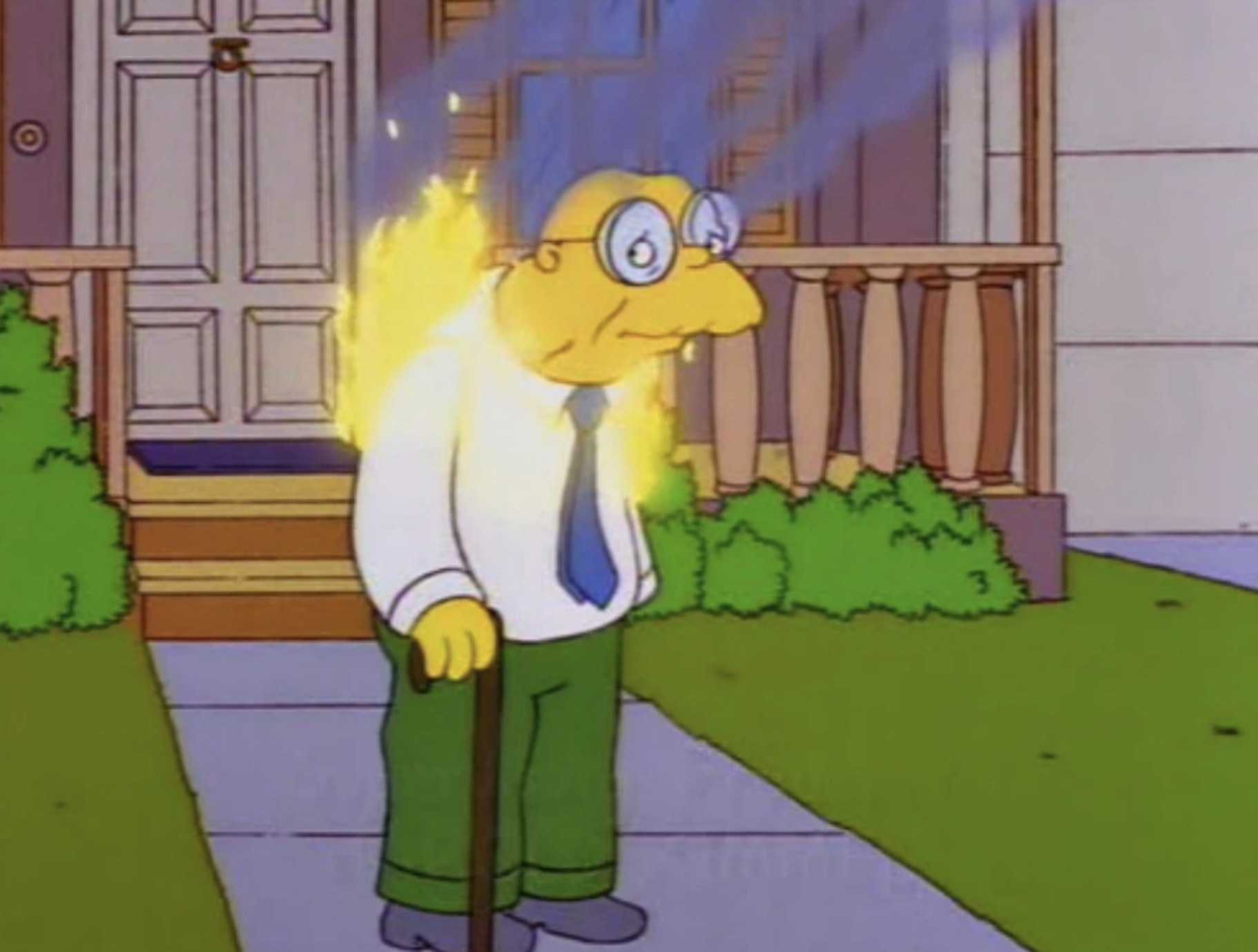 Hans Moleman stands in front of a house, and he&#x27;s on fire