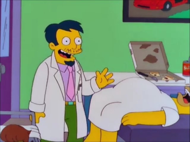 Doctor Nick smiles and waves from a medical room, where Homer is unconscious and there&#x27;s a half-eaten pizza behind him